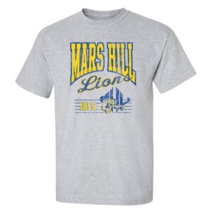 gray t-shirt the Mars Hill in arched yellow text with blue outline, Lions in baseball script below, and below that is 1856 and the MHU athletics logo over a blue horizontal series of stripes