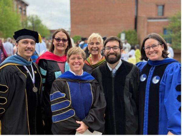 (l-r) Justin Williams, Natalie Boone, Michelle Gilley, Joy Clifton, Brad Alban, Karie Hunt; pictured following spring 2025 graduation; all wearing academic regalia