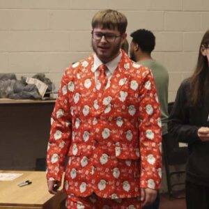 Student wearing a Santa sportcoat and pants