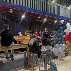 students at a party in the Loft with balloons