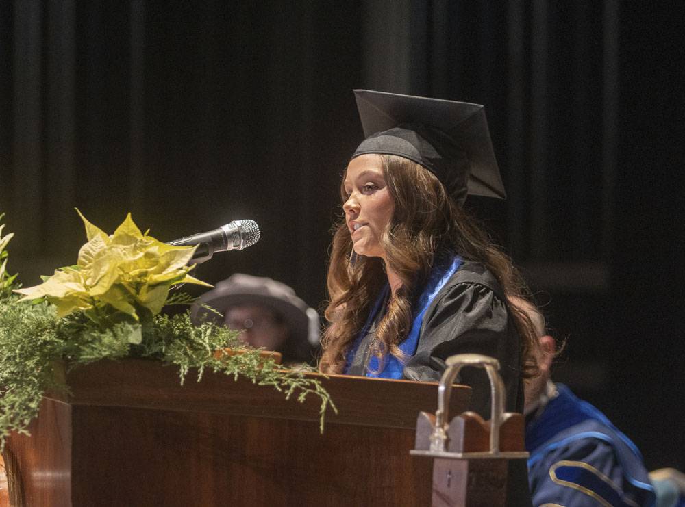 Ashlin speaks at the podium