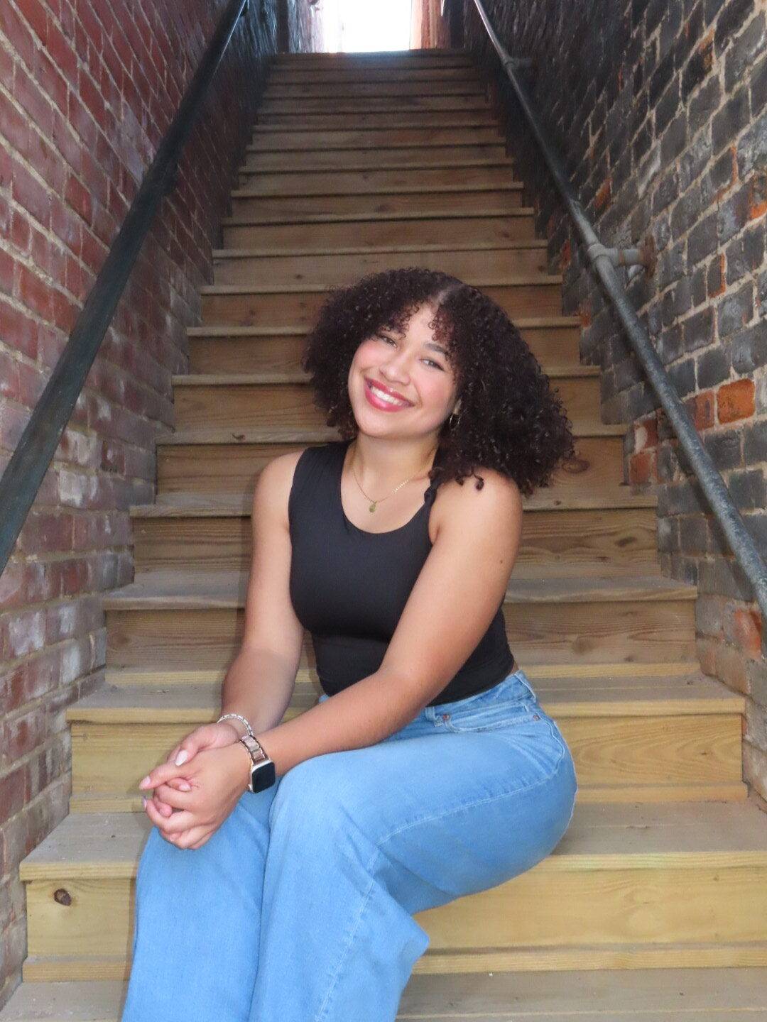 Chloe, sitting on steps