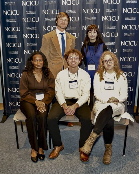 Ethics Bowl team poses in front of NCICU-logoed banner